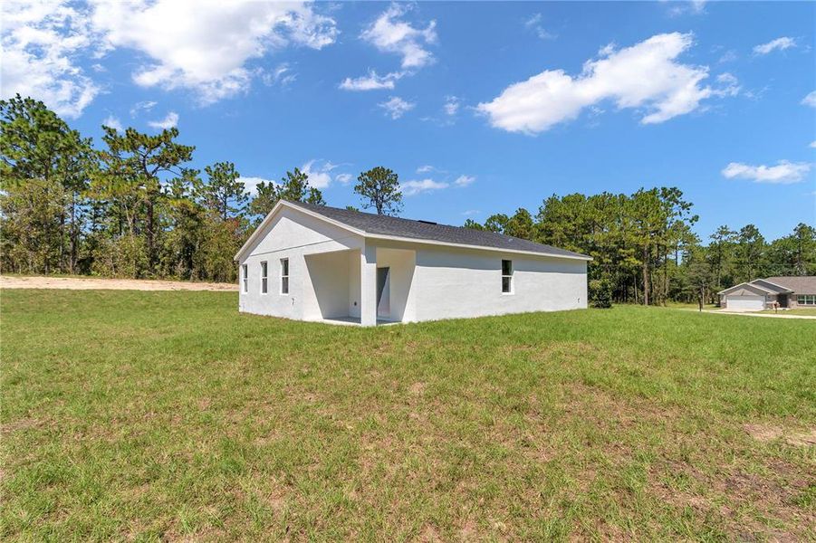 Front exterior of a new home in , Dunnellon, FL, highlighting curb appeal (Image 29).
