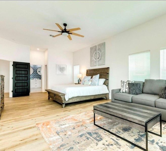 Spacious, comfortable primary suite with sitting area