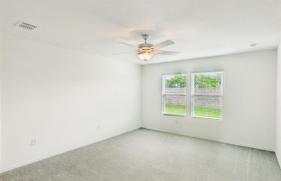 Spacious secondary bedroom with ample closet space *real home pictured