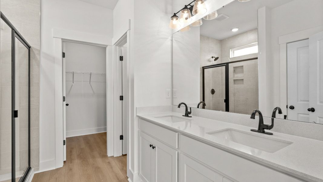 Elegant primary bath with dual vanity and stylish finishes for everyday comfort.
