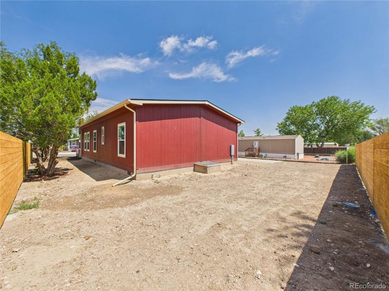 Fenced back and side property