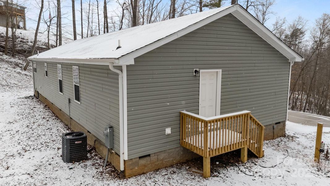 Front exterior of a new home in , Candler, NC, highlighting curb appeal (Image 19).