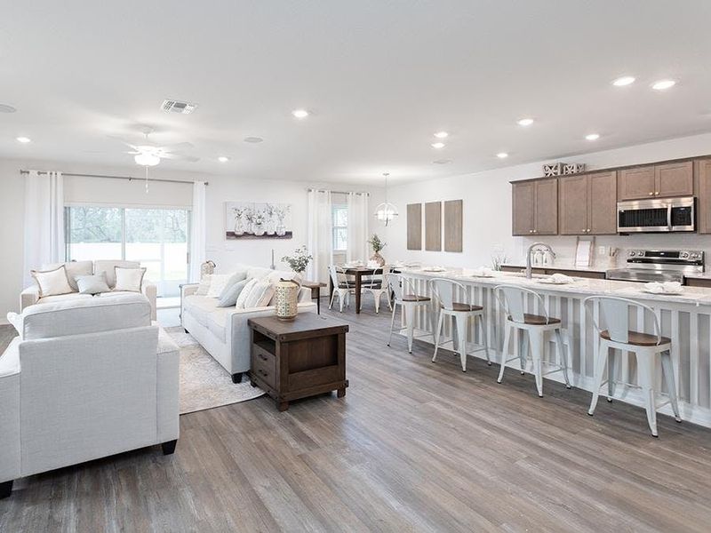 This 2-story home features a spacious open living area - Wesley II by Highland Homes This 2-story home features a spacious open living area - Wesley II by Highland Homes
