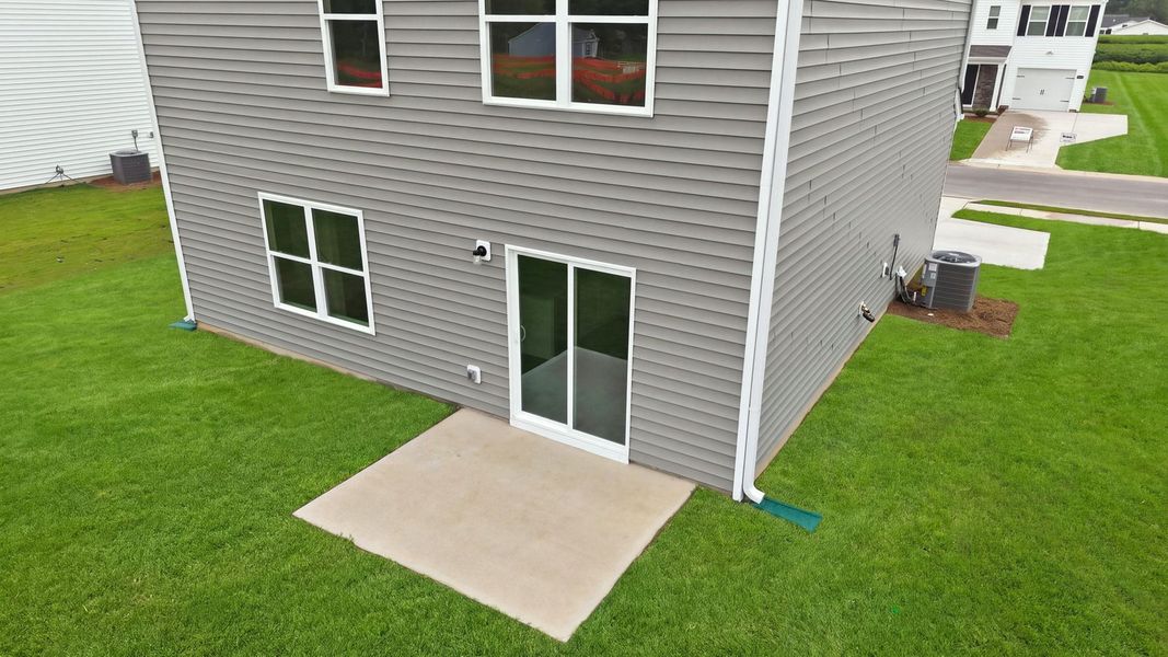 Exterior details and patio area of a home in Hobbs Farm, Ayden (Image 26).