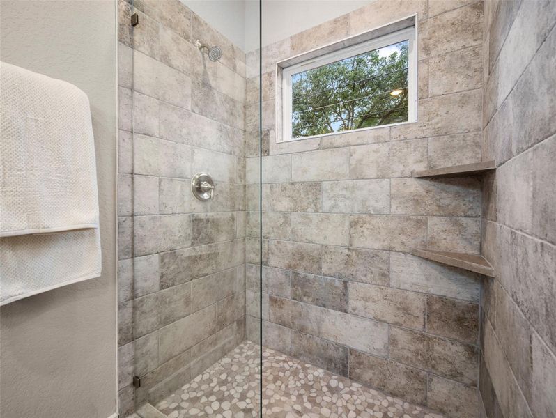 Full bath featuring a stall shower Full bath featuring a stall shower