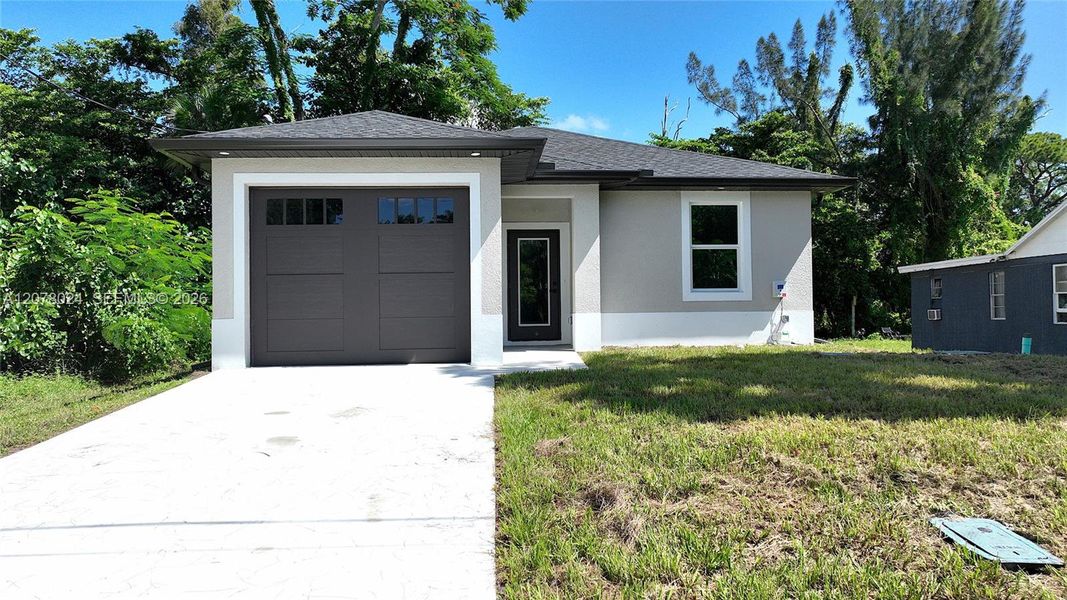 Front exterior of a new home in , Fort Myers, FL, highlighting curb appeal (Image 2). Front exterior of a new home in , Fort Myers, FL, highlighting curb appeal (Image 2).