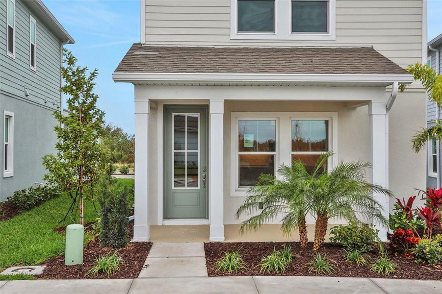 Front exterior of a new home in Bungalow Walk at Lakewood Ranch, Sarasota, FL, highlighting curb appeal (Image 18).