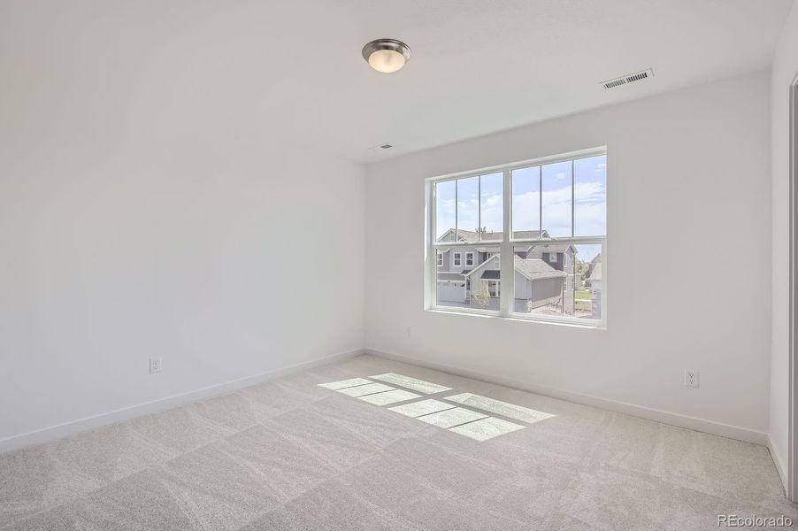 Spacious, unfurnished interior of a new home in Riano Ridge: The Monarch Collection, Loveland (Image 11).