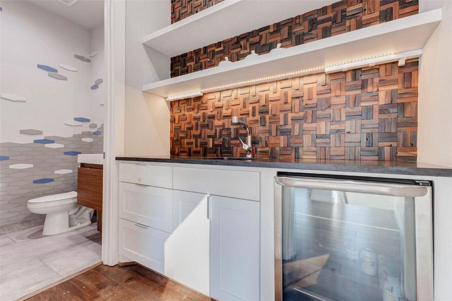WET BAR, BEVERAGE FRIDGE AND HALF BATH IN BONUS ROOM