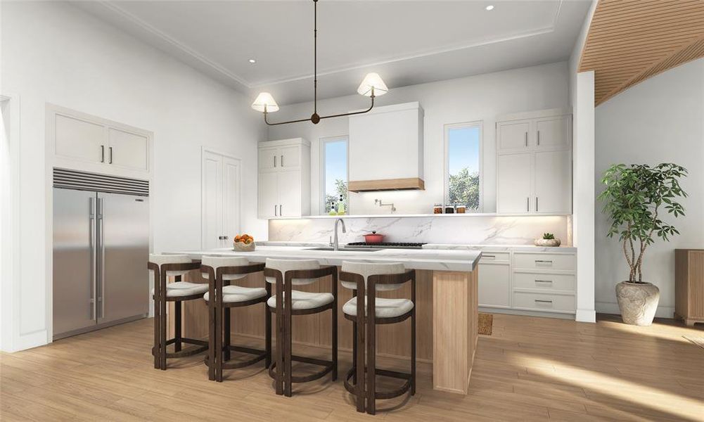 This spacious open-concept kitchen features stainless-steel appliances and quartz countertops.