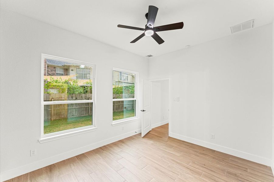 Another view of the primary bedroom and the large windows. Another view of the primary bedroom and the large windows.