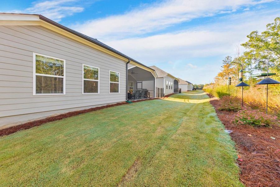 Exterior details and patio area of a home in Madeira, Acworth (Image 25).