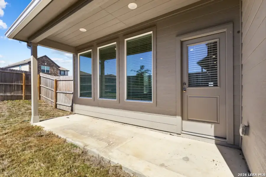 Exterior details and patio area of a home in Hightop Ridge, Converse (Image 29).