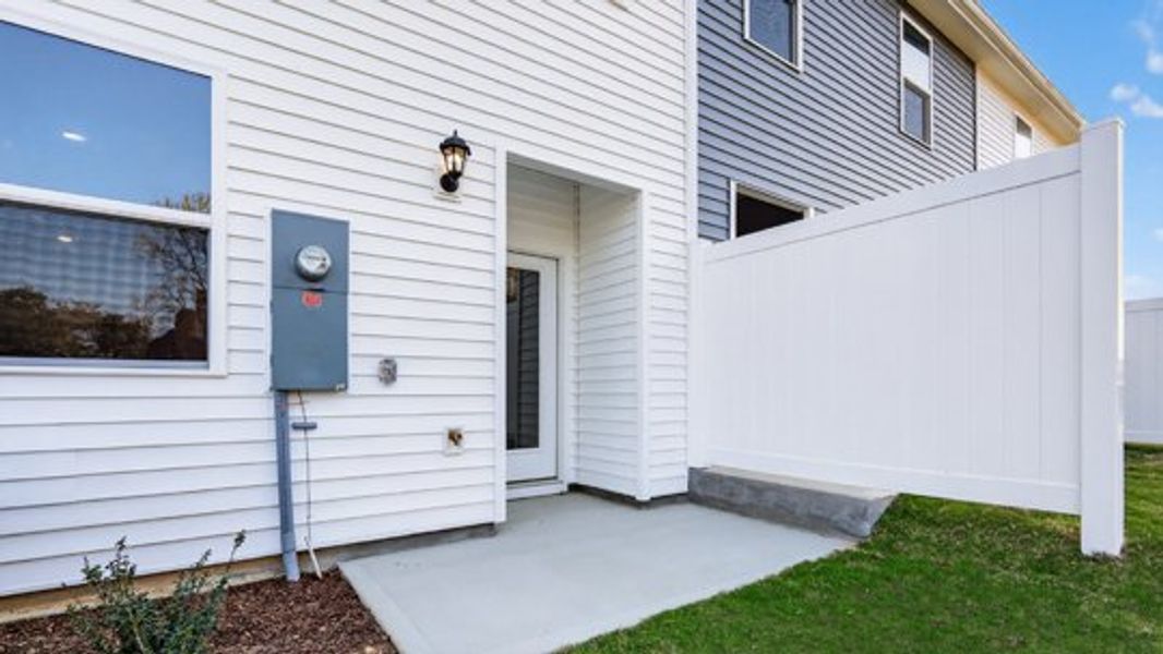 Exterior details and patio area of a home in The Townes at Prestleigh, Wake Forest (Image 3).
