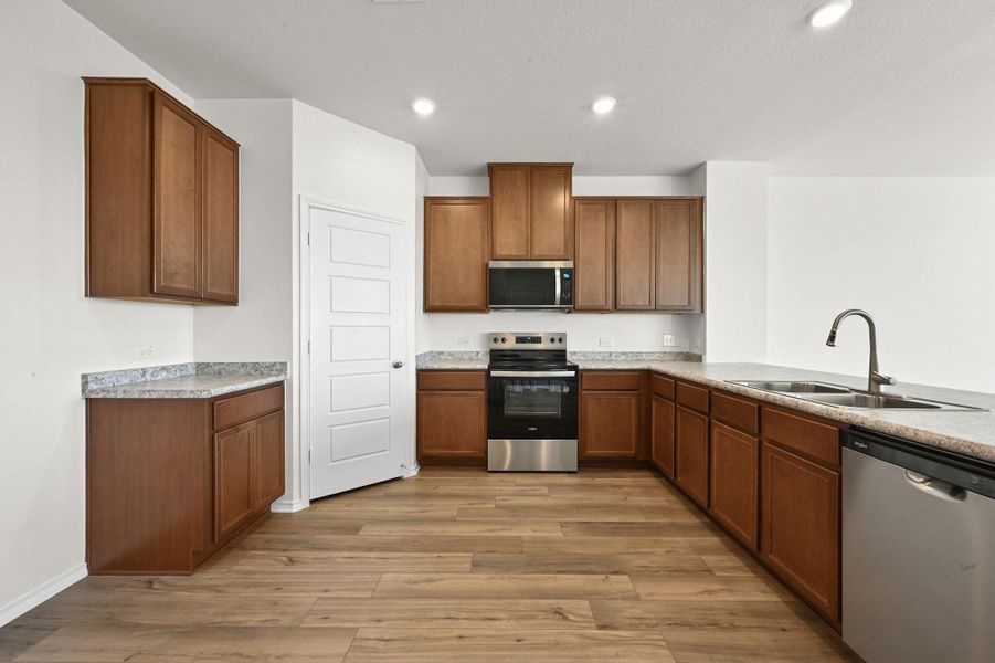 Furnished interior view inside a new home in Stoney Chase, Del Valle (Image 14).