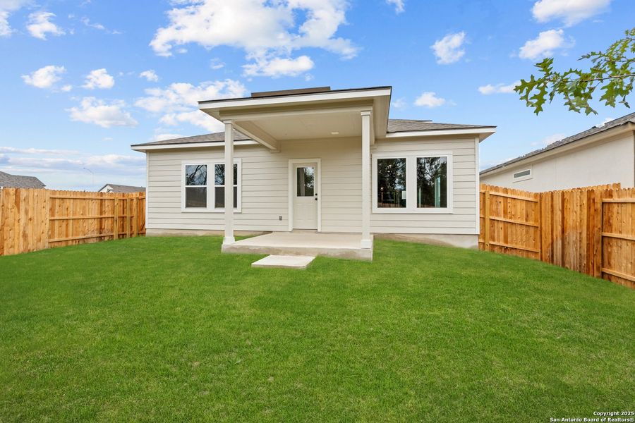 Front exterior of a new home in August Fields, New Braunfels, TX, highlighting curb appeal (Image 2). Front exterior of a new home in August Fields, New Braunfels, TX, highlighting curb appeal (Image 2).