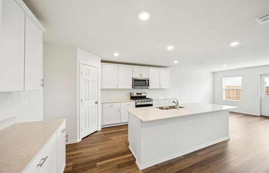 Spacious kitchen with eat-in bar top island Spacious kitchen with eat-in bar top island