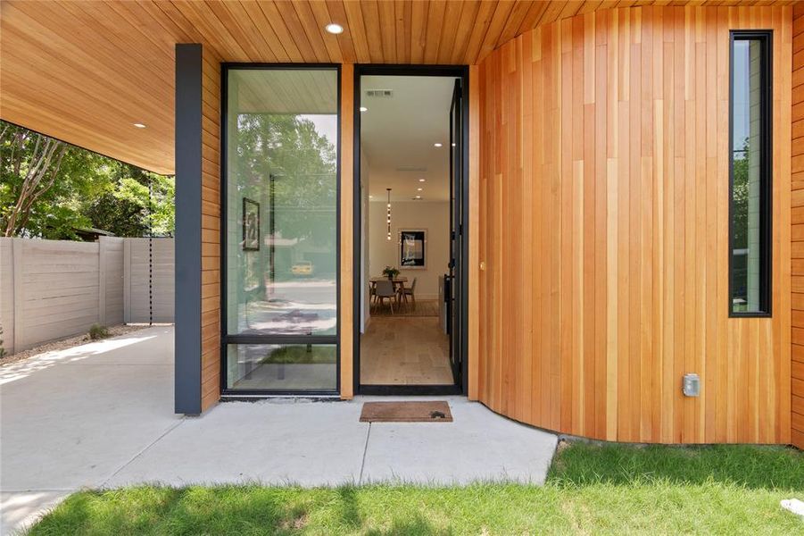 Vertical grain hemlock wood accents add warmth to the entrance