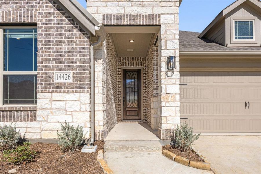 Exterior details and patio area of a home in Creekview Meadows, Pilot Point (Image 26).