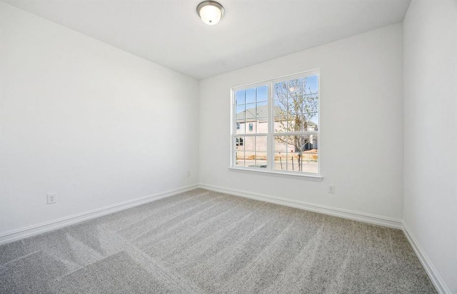 Inviting bedroom on first floor offering soft natural light Inviting bedroom on first floor offering soft natural light