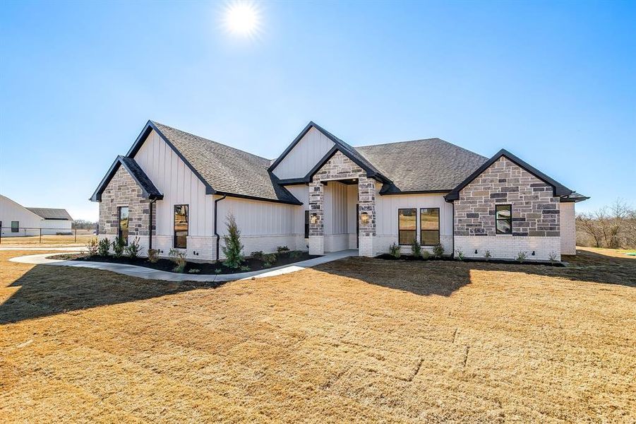 Front exterior of a new home in , Weatherford, TX, highlighting curb appeal (Image 25).