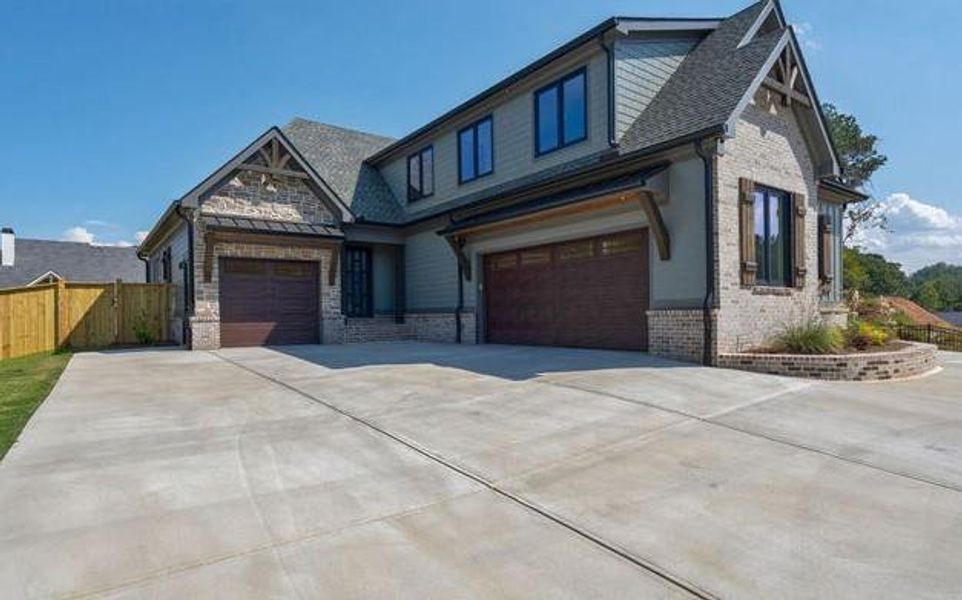Front exterior of a new home in , Cumming, GA, highlighting curb appeal (Image 39).