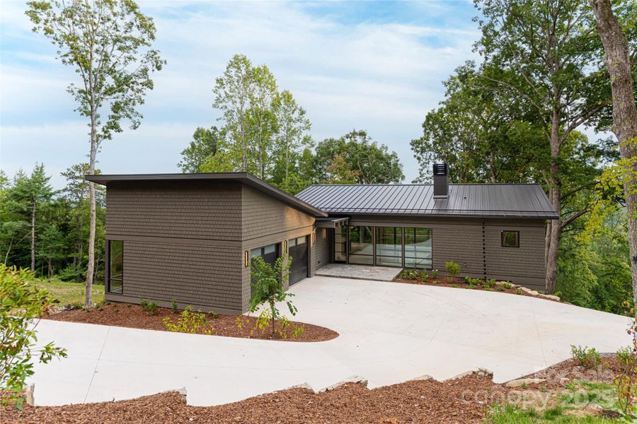 Front exterior of a new home in , Hendersonville, NC, highlighting curb appeal (Image 24).