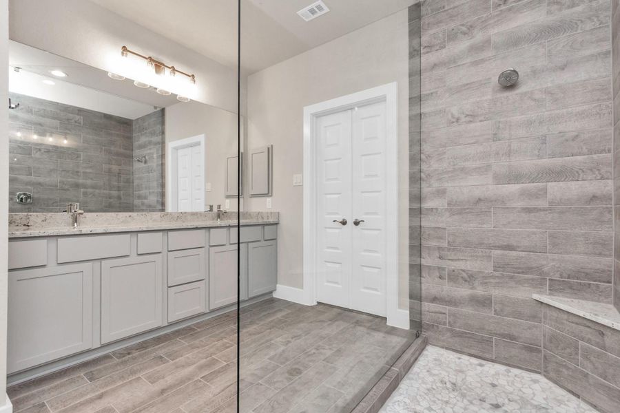 Broadcasting a wider view of your primary bathroom retreat. Sample photo of completed home with similar floor plan. Actual colors and selections may vary. Broadcasting a wider view of your primary bathroom retreat. Sample photo of completed home with similar floor plan. Actual colors and selections may vary.