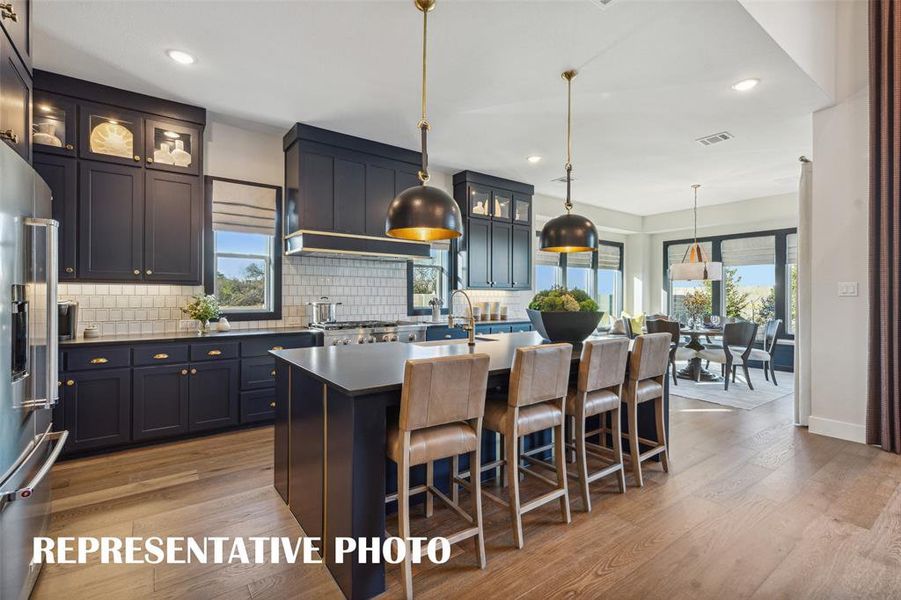 Featuring a chef's dream kitchen that is open to the family and dining rooms, entertaining is a breeze in our Madison II floor plan.  REPRESENTATIVE PHOTO
