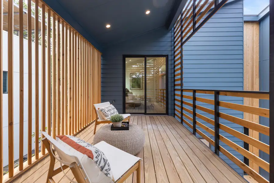 This secluded deck provides a comfortable outdoor escape directly off the primary suite. This secluded deck provides a comfortable outdoor escape directly off the primary suite.