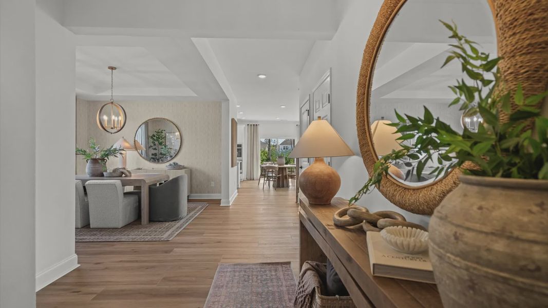 Wynwood home plan front entry hallway leading into dining room and living space Wynwood home plan front entry hallway leading into dining room and living space