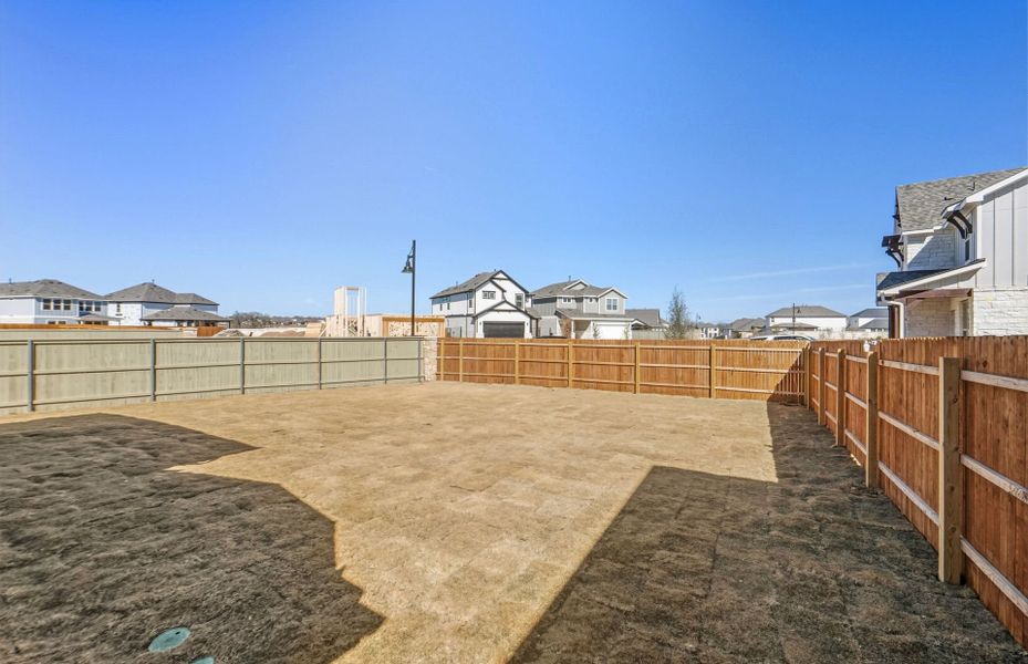 Exterior details and patio area of a home in Santa Rita Ranch, Liberty Hill (Image 29).