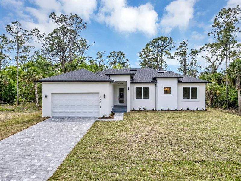 Front exterior of a new home in , Port Charlotte, FL, highlighting curb appeal (Image 23).
