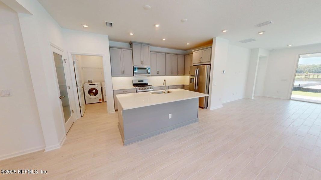 Furnished interior view inside a new home in RiverTown - WaterSong, St. Johns (Image 9).