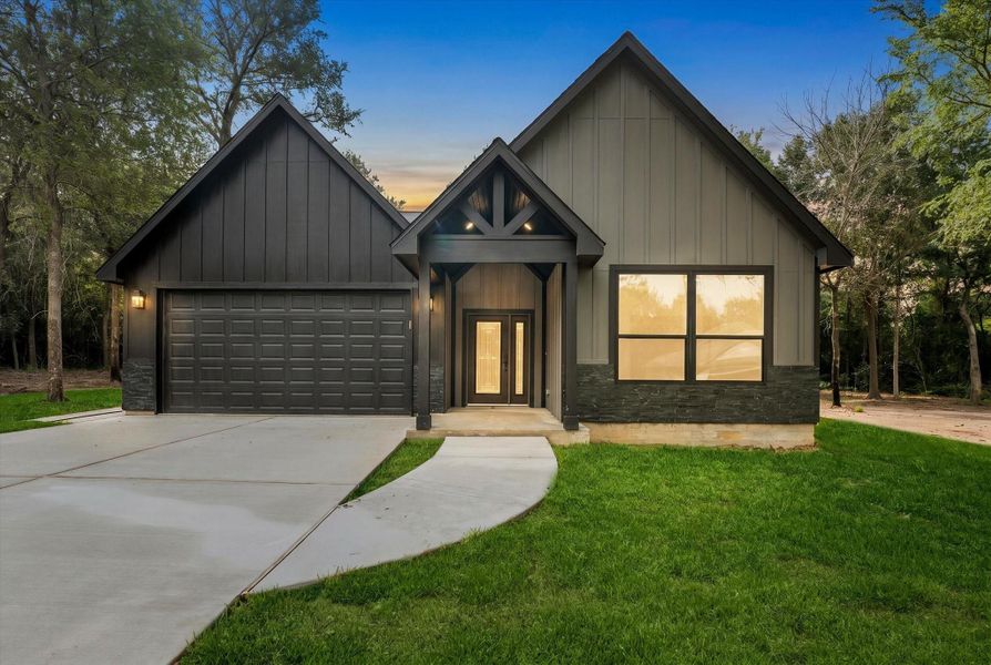 Front exterior of a new home in , Hempstead, TX, highlighting curb appeal (Image 24). Front exterior of a new home in , Hempstead, TX, highlighting curb appeal (Image 24).