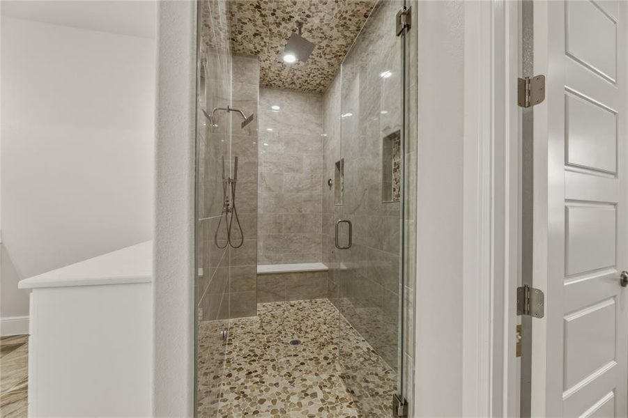Double shower with sitting area plus a steam shower Double shower with sitting area plus a steam shower