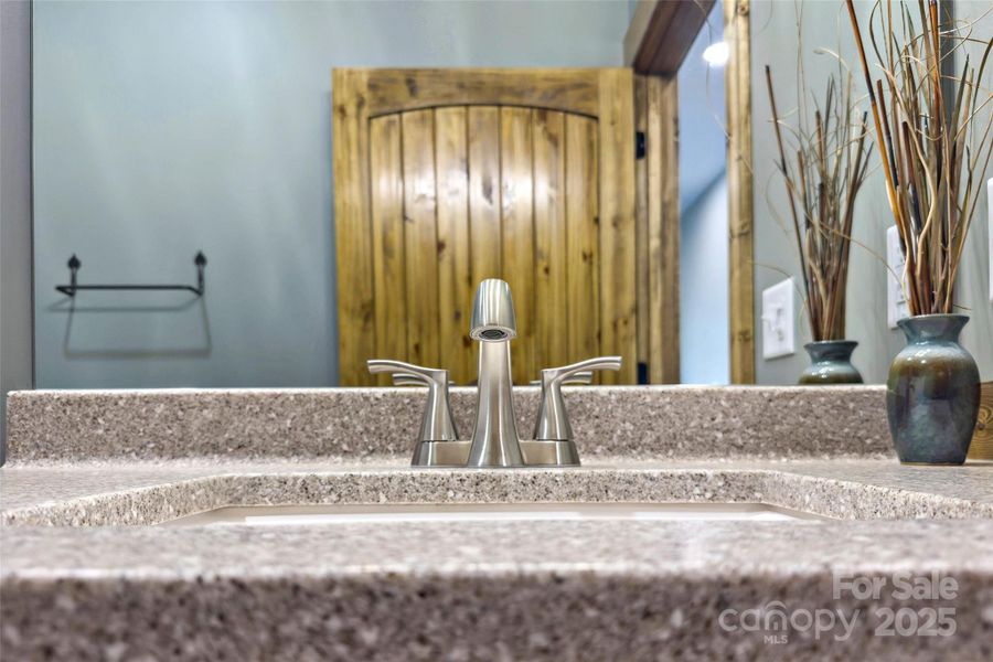 Guest bathroom on main level Guest bathroom on main level