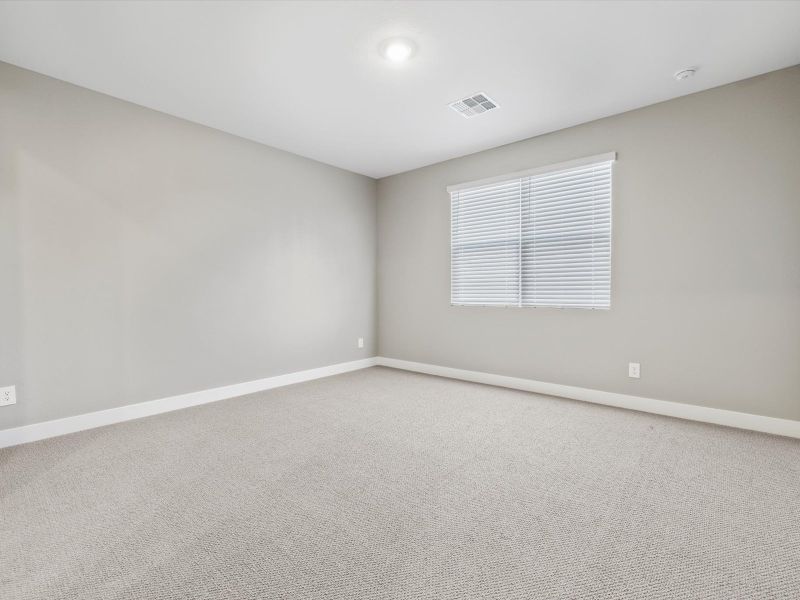 Spacious, unfurnished interior of a new home in Blossom Rock Reserve Series, Apache Junction (Image 8).