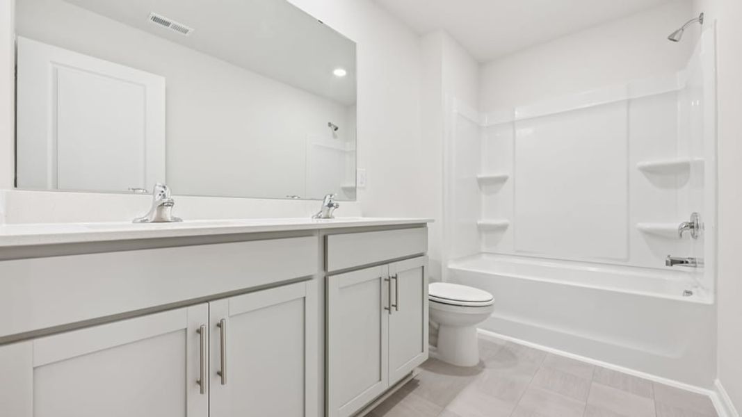 Furnished interior view inside a new home in Gretchen Pines, West End (Image 8).