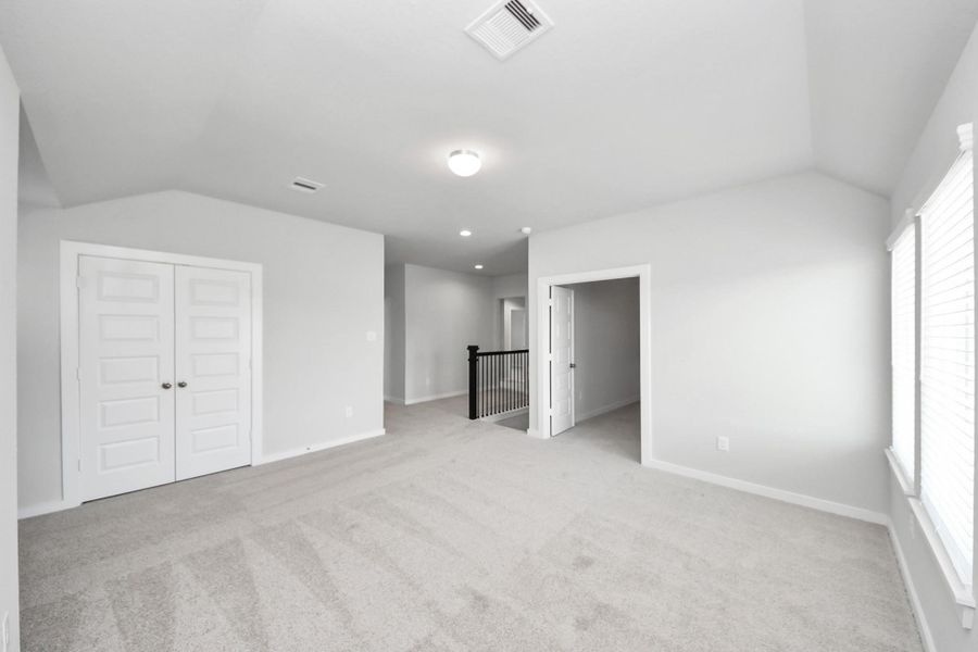 Come upstairs and enjoy a day of leisure in this fabulous game room! This is the perfect hangout spot or adult game room! Features plush carpet, high ceilings, custom paint and windows for plenty of natural light. Come upstairs and enjoy a day of leisure in this fabulous game room! This is the perfect hangout spot or adult game room! Features plush carpet, high ceilings, custom paint and windows for plenty of natural light.