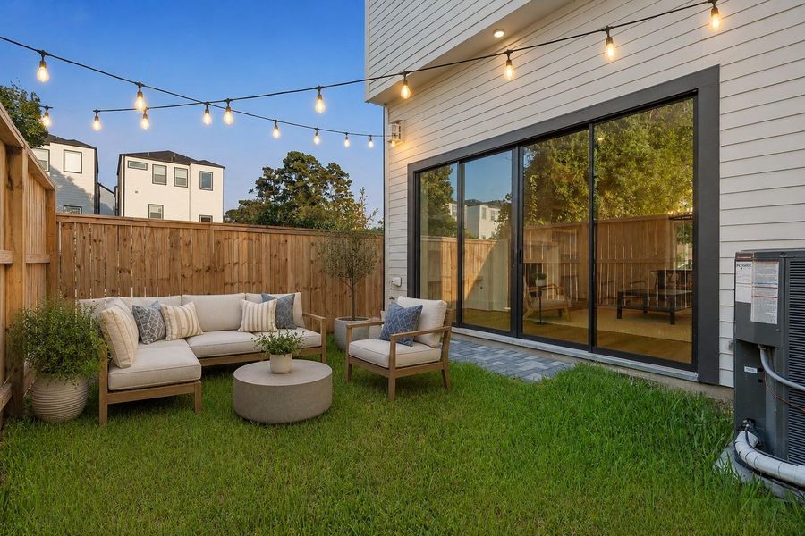 Outdoor Oasis - Accessed through large sliding glass doors from the living room. This space isideal for lounging, grilling, outdoor dining and relaxing. Your secluded sanctuary for play withfamily and pets.
