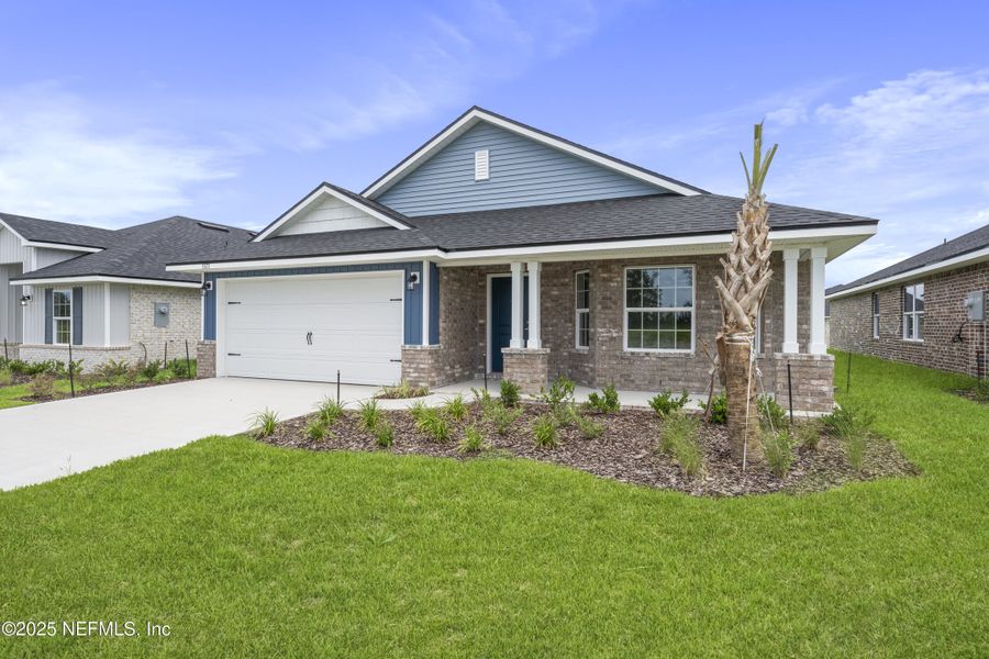 Front exterior of a new home in Shadow Crest at Rolling Hills, Green Cove Springs, FL, highlighting curb appeal (Image 15).