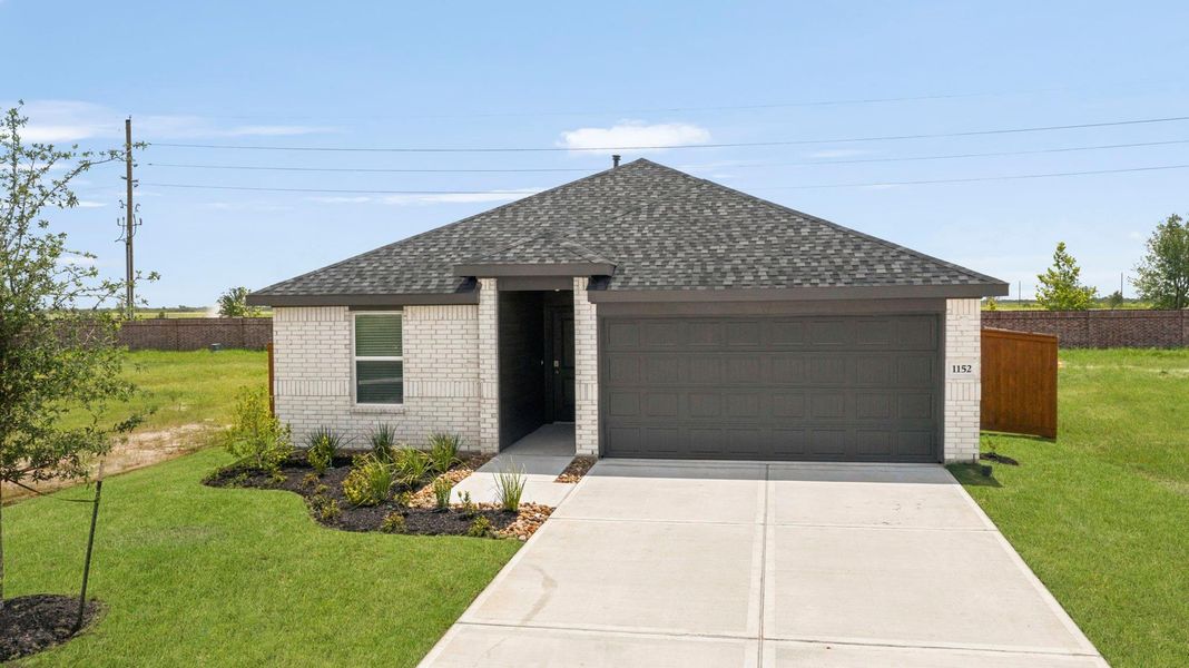 Front exterior of a new home in Sunterra Lakes, Brookshire, TX, highlighting curb appeal (Image 1). Front exterior of a new home in Sunterra Lakes, Brookshire, TX, highlighting curb appeal (Image 1).