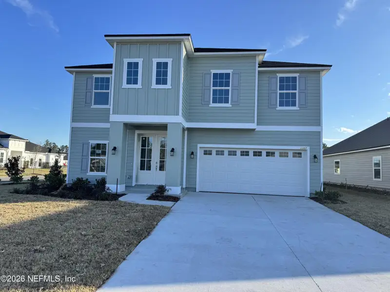 Front exterior of a new home in Hyland Trail, Green Cove Springs, FL, highlighting curb appeal (Image 1). Front exterior of a new home in Hyland Trail, Green Cove Springs, FL, highlighting curb appeal (Image 1).