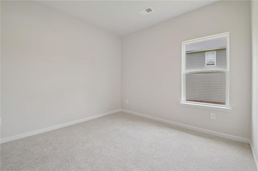Spacious, unfurnished interior of a new home in Northwoods at Mirror Lake, Villa Rica (Image 36).
