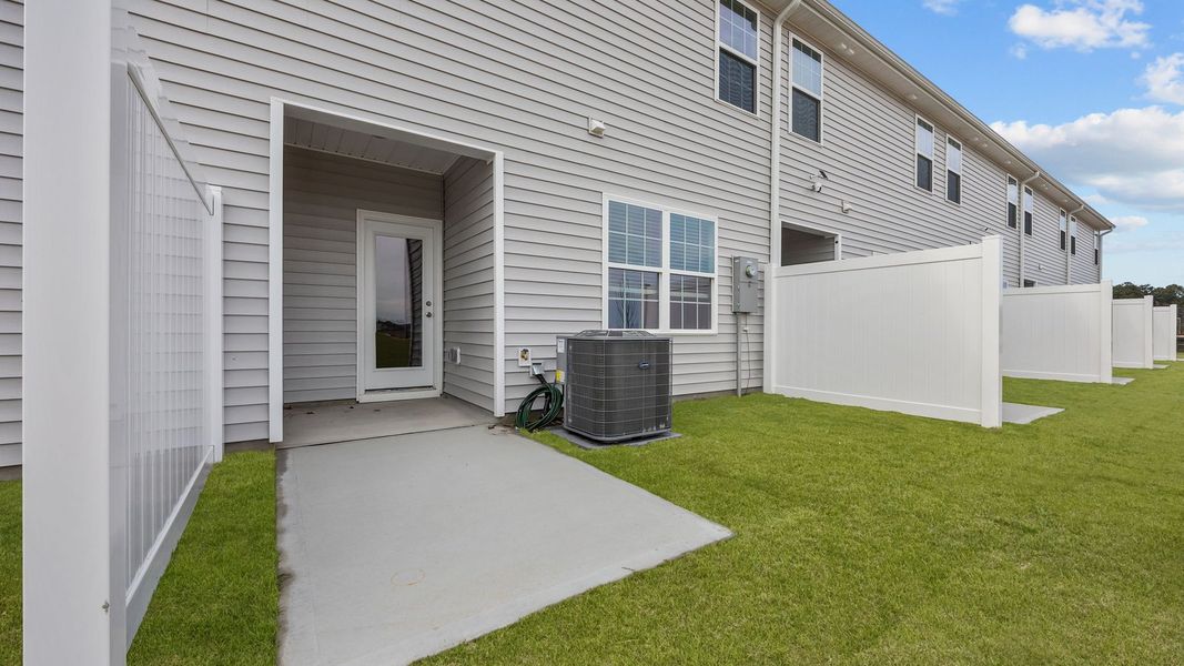 Exterior details and patio area of a home in The Townes at Ridgewood Farms, Winterville (Image 4). Exterior details and patio area of a home in The Townes at Ridgewood Farms, Winterville (Image 4).