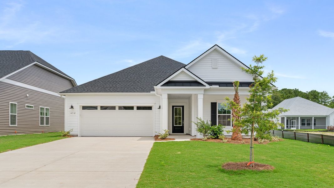 Representative exterior photo of a completed home built from the The Enthusiast by DRB Elevate. in Summerwind Crossing at Lakes of Cane Bay, Summerville, SC (Image 16). Representative exterior photo of a completed home built from the The Enthusiast by DRB Elevate. in Summerwind Crossing at Lakes of Cane Bay, Summerville, SC (Image 16).