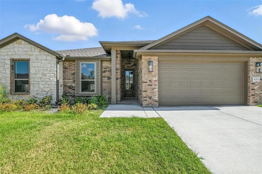 Front exterior of a new home in Willow Vista Estates, Saginaw, TX, highlighting curb appeal (Image 1). Front exterior of a new home in Willow Vista Estates, Saginaw, TX, highlighting curb appeal (Image 1).