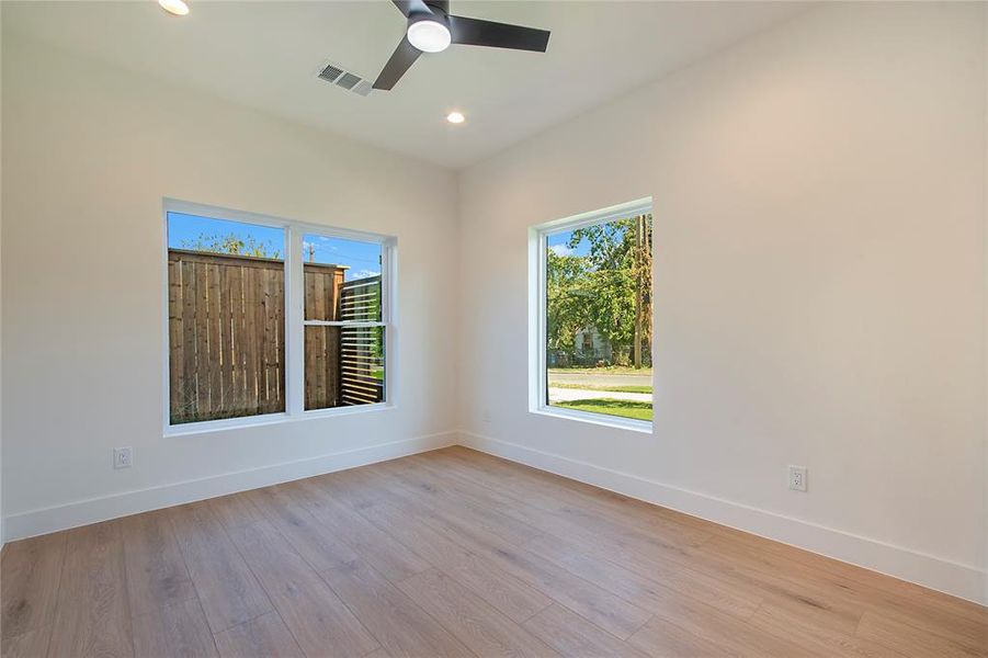 Unfurnished room featuring light wood-style floors, recessed lighting, and a ceiling fan Unfurnished room featuring light wood-style floors, recessed lighting, and a ceiling fan