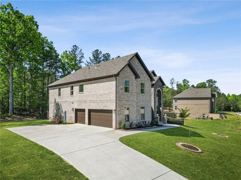 Front exterior of a new home in , Fairburn, GA, highlighting curb appeal (Image 24).